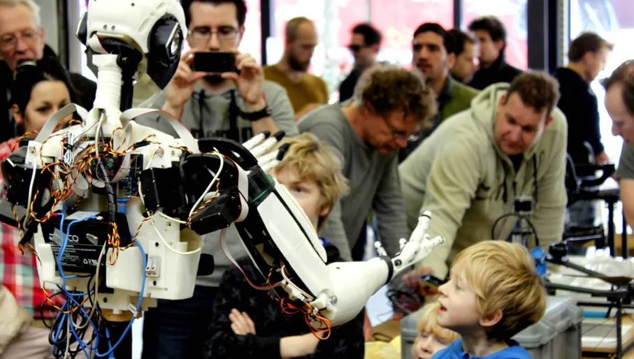 Two children interacting with a robot