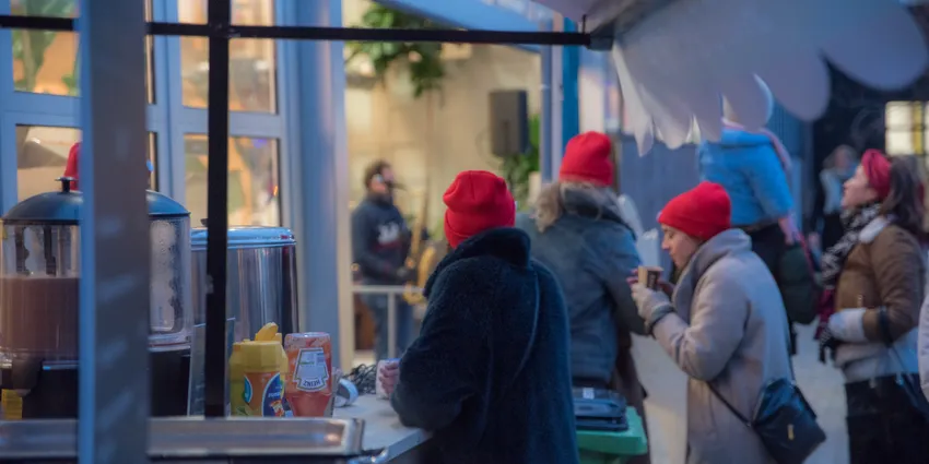 People standing around Santas candy shop