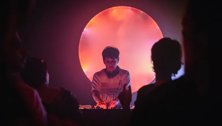 Radio Radio DJ playing music and people dancing