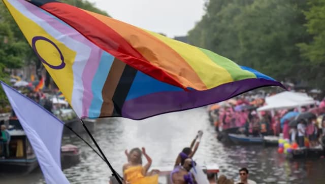 Big rainbow flag during the Canal Parade of Amsterdam Pride 2025.
