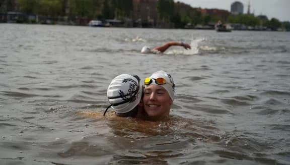 Couple of swimmers embracing during LoveSwim 2024
