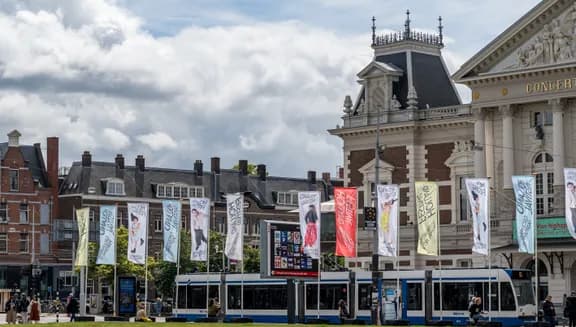 Holland Festival 2024 flags at Museumplein in front of Het Concertgebouw.