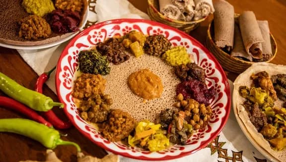 Dishes at Kilimanjaro Take Me Away Ethiopian-Eritrean restaurant in Oost