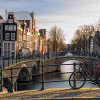 Bike parked on the bridge at Reguliersgracht in Winter