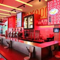 Pink neon interiors of OTEMBA-gyoza Japanese restaurant on Van Woustraat in De Pijp