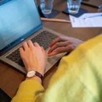 A business man working on his laptop.
