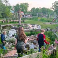 Pof restaurant kids playing in the garden
