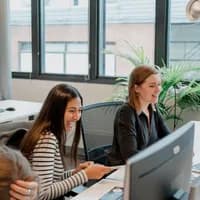 Alexandra Belicova and Kriya Mehta at the office