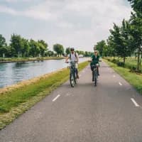 Man and woman cycling in the countryside