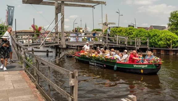 People on a boat tour on the Westeinderplassen lakes near Aalsmeer.