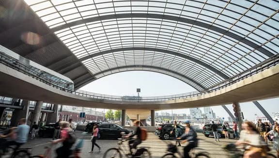 Cyclist at Amsterdam Centraal Station.