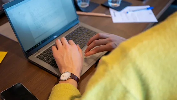 A business man working on his laptop.