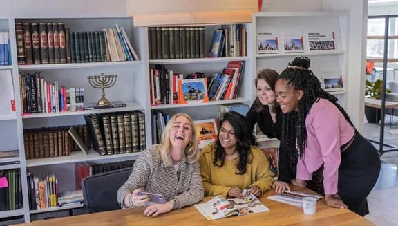 Colleagues working and  reading in the meeting room
