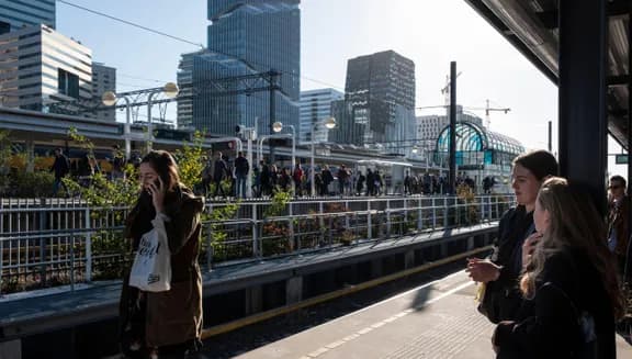 2AE4KGB Young office workers at the business hub Amsterdam South (Zuidas) in Amsterdam, Netherlands, close to Schiphol Airport.