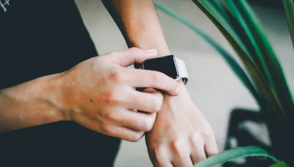 Man using smart watch on his wrist