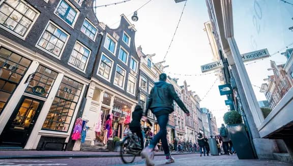Shoppers at the Negen Straatjes shopping area.