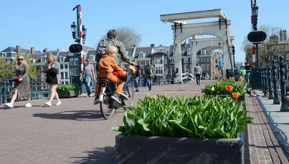 People walking and cycling over the  Magere Bridge