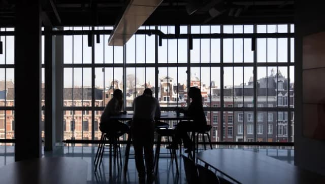 People at table in city centre office
