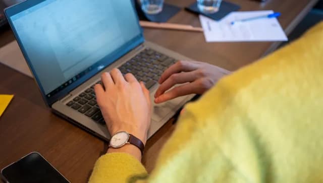 A business man working on his laptop.