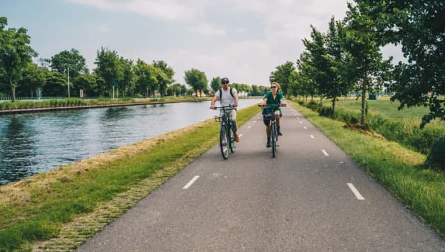 Man and woman cycling in the countryside