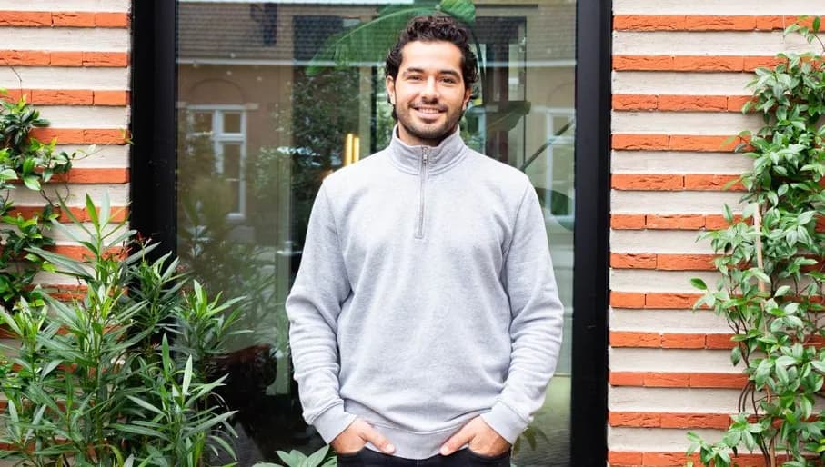 Portrait of Konstantinos Kouzelis, founder of Greencast, standing outside a building