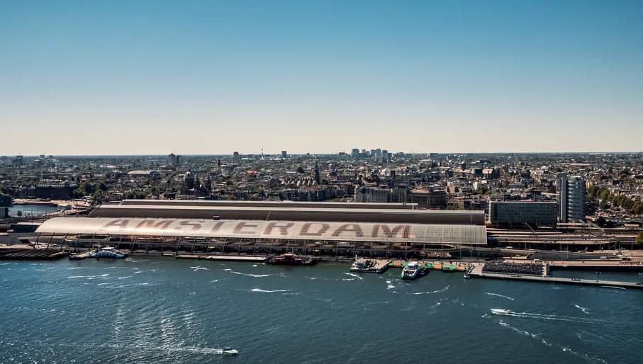 Summer skyline photo showing Amsterdam centraal station and views over the city
