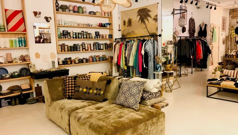 Store A Lovely Day interior, couch sofa with items in the background