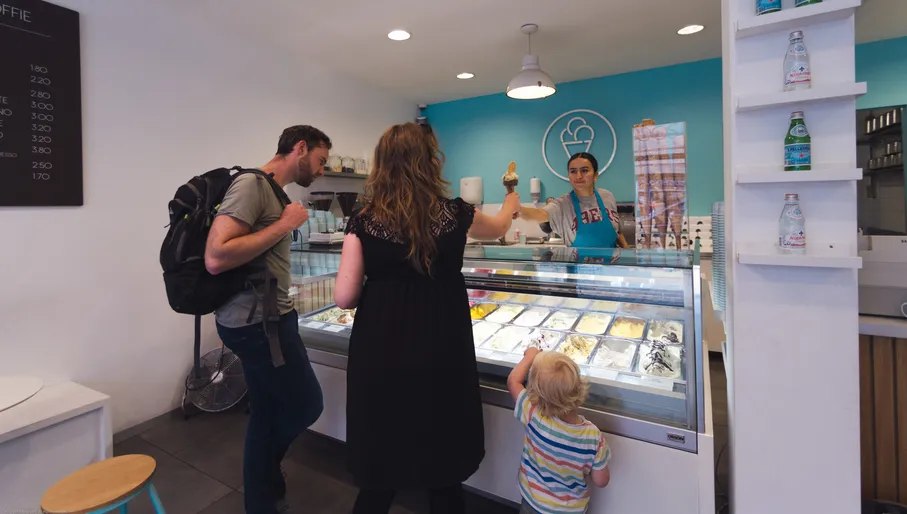 Server selling  ice cream to the customers