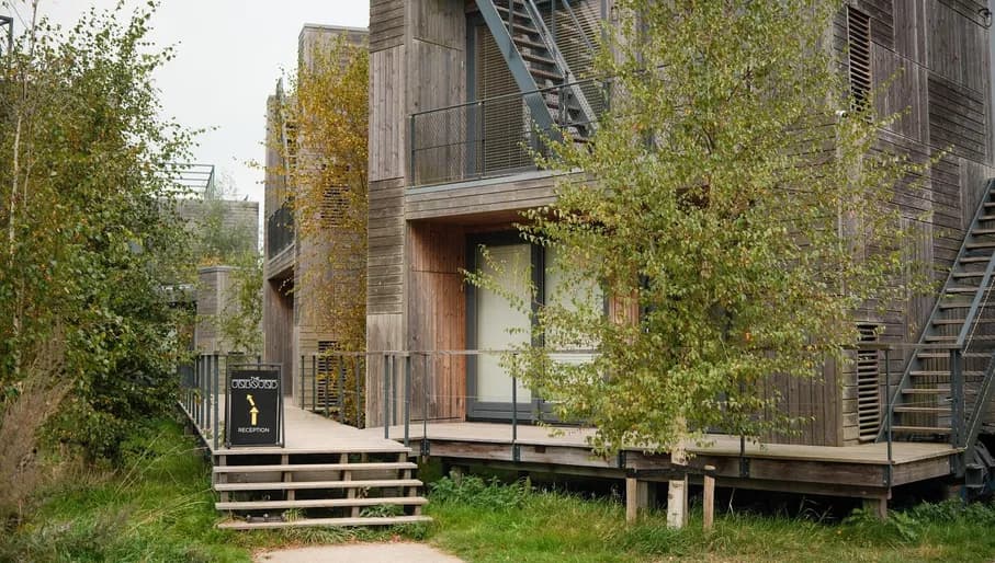 Entrance of Unbound hotel with sign pointing towards reception