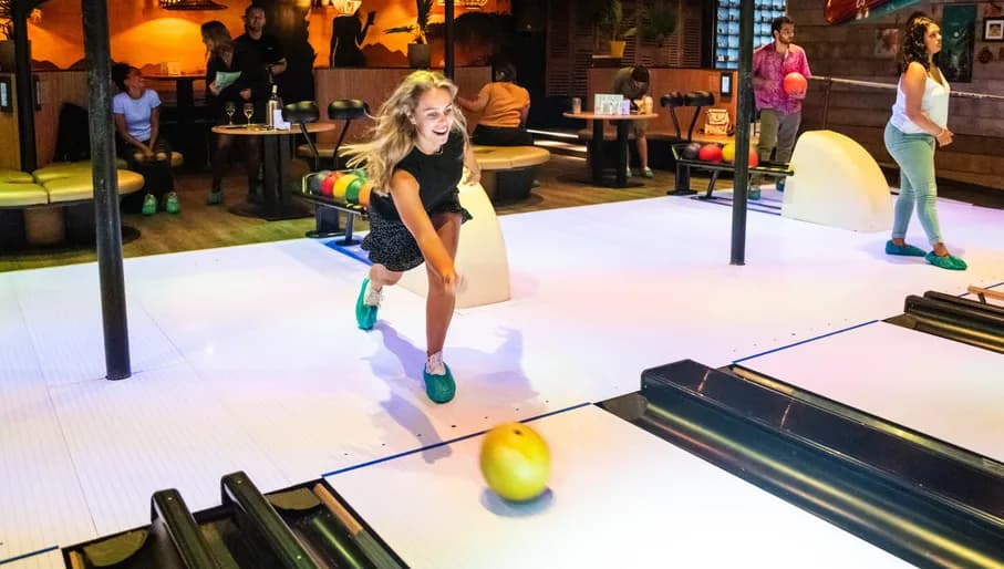 Aloha game center, woman bowling