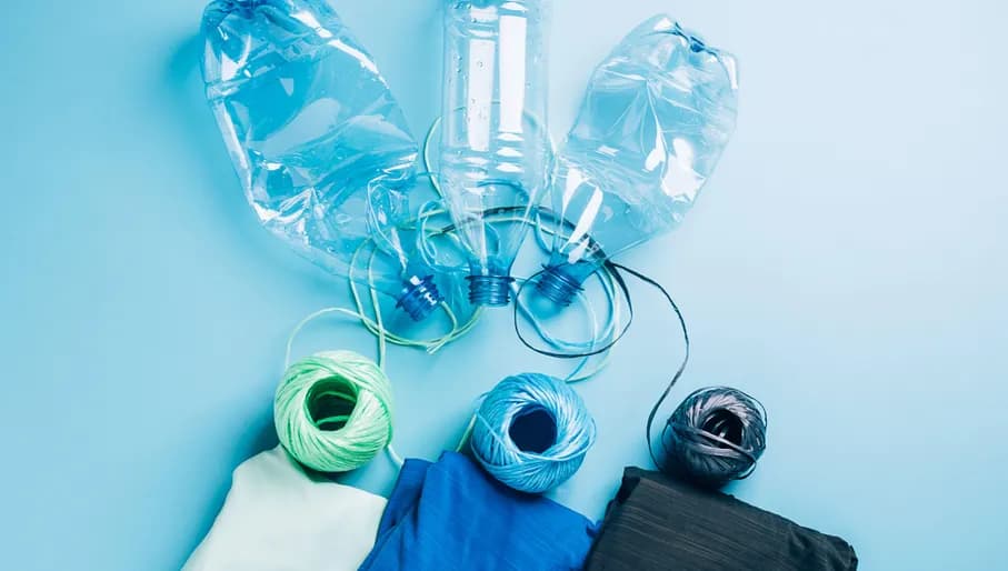 2G7C3TY Polyester fiber synthetic fabrics eco-friendly textile recycled recyclable plastic bottles. Reuse recycling used bottles