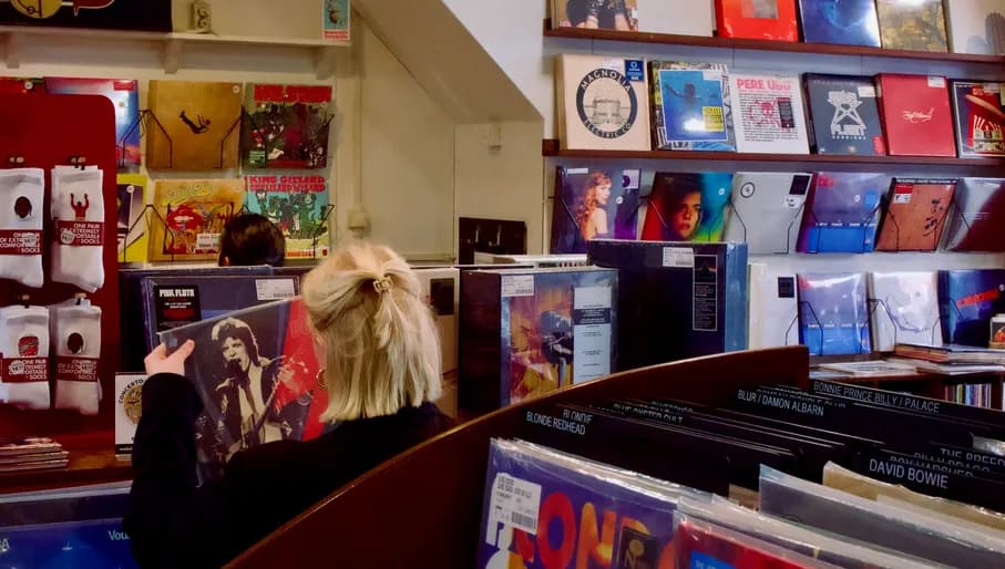 girl looking at vinyl inside concerto records shop
