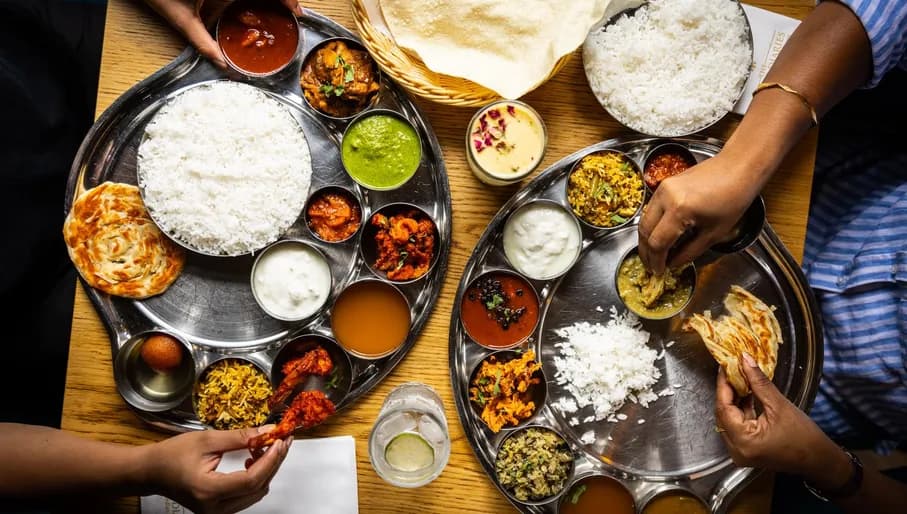 Enjoying a thali of dishes at The Madras Diaries Indian Restaurant