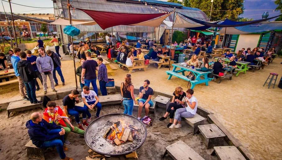 People sitting round fire at Noorderlicht