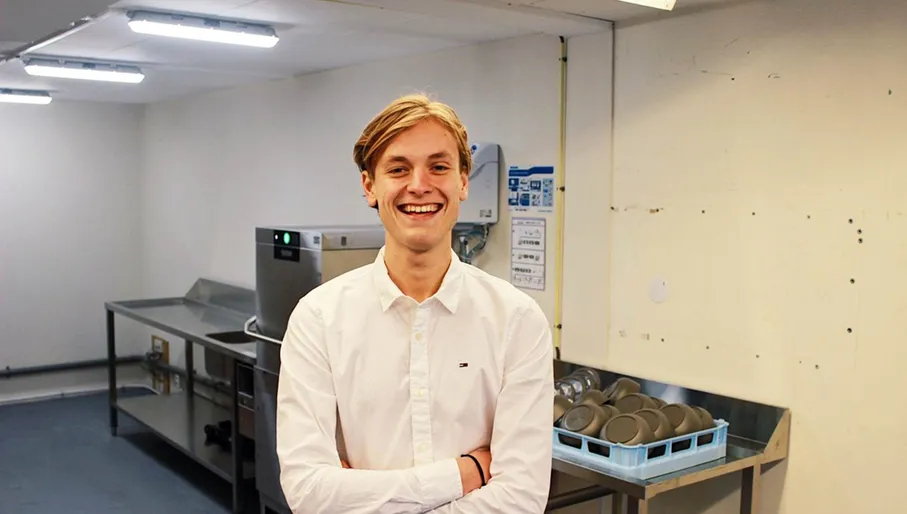 Portrait of SwapBox co-founder Maurits Last inside industrial area.