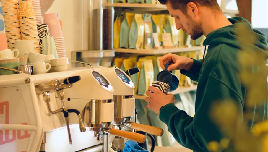 Rum Baba café man preparing coffee