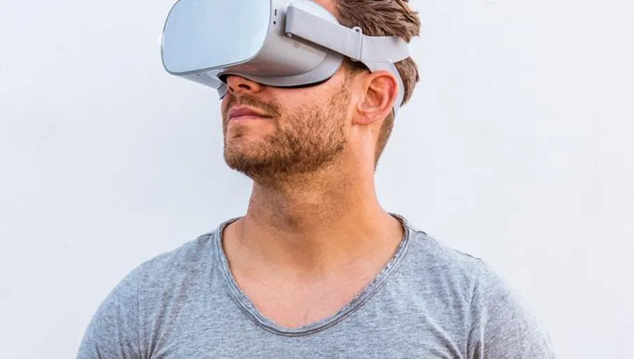 A man wearing virtual reality glasses
