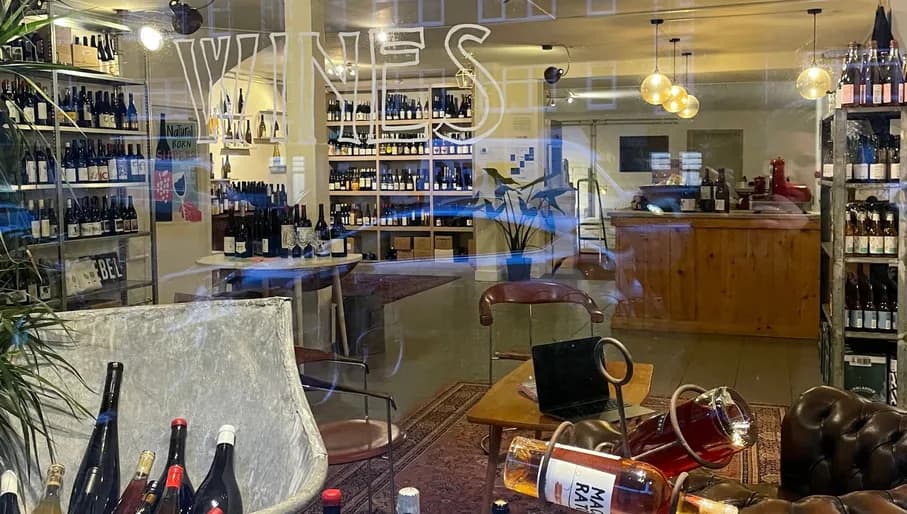 Rebel Wines view through the window of the wineshop interior and bottle display