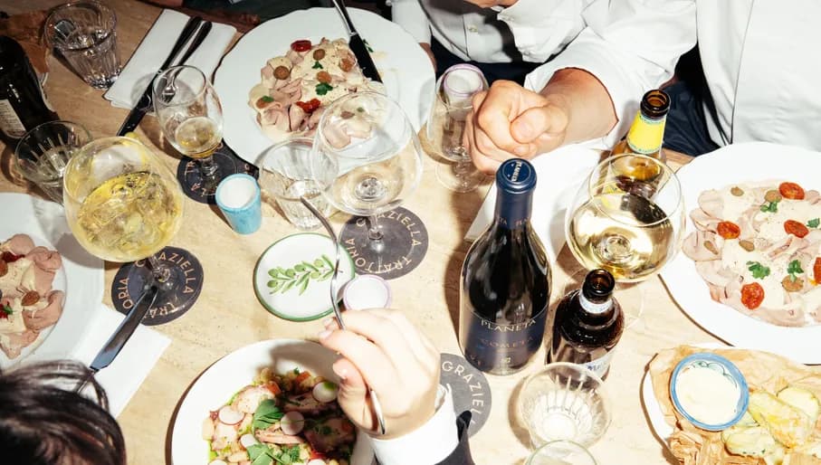 Trattoria Graziella people enjoying food & drinks together