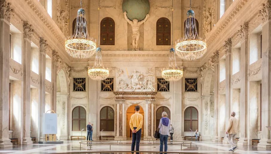 People wandering through the Royal Palace at Dam Square. Koninklijk Paleis op de Dam