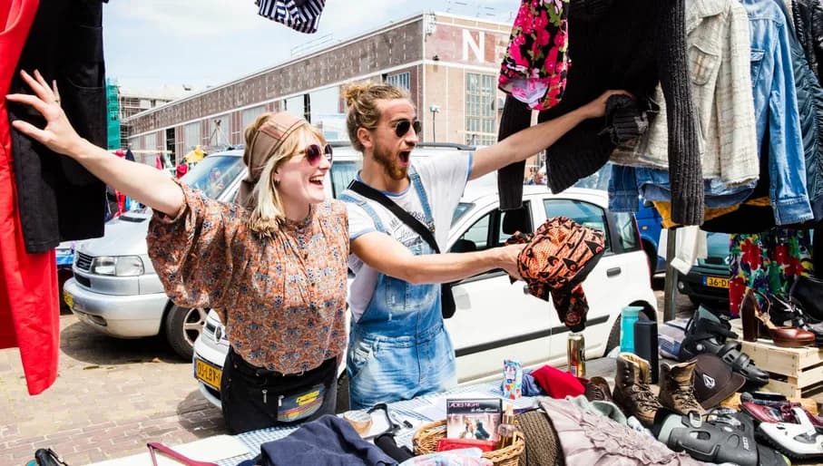 Man and woman selling clothes at IJhallen