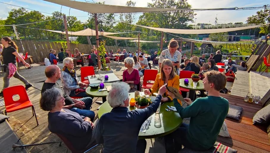 Pof restaurant people sitting on the terrace