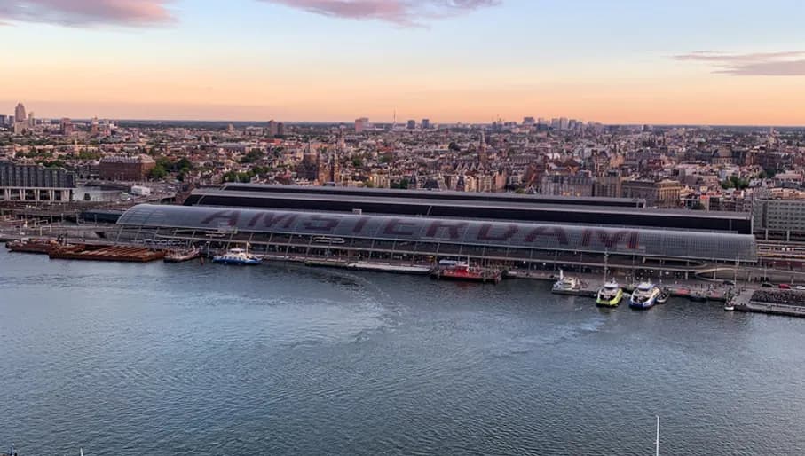 Aerial view on Amsterdam Central Train Station and 't IJ.