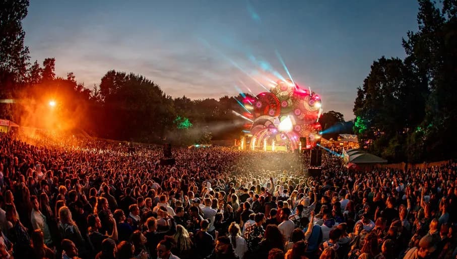 Dancers and stage at Amsterdam Open Air Festival, outdoor music festival at Gaasperpark in Zuidoost