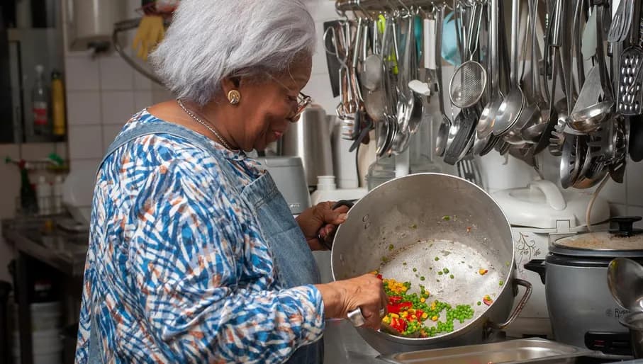 Floor the chef cooking at Floor's Catering roti shop Amsterdam