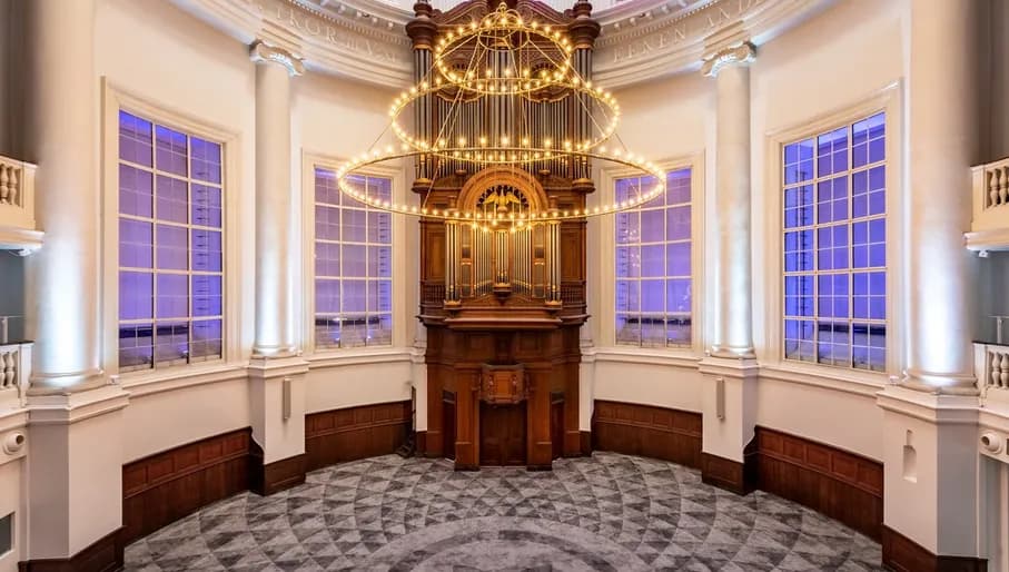 Interior of Renaissance Hotel, with picturesque chandelier and small pipe organ.