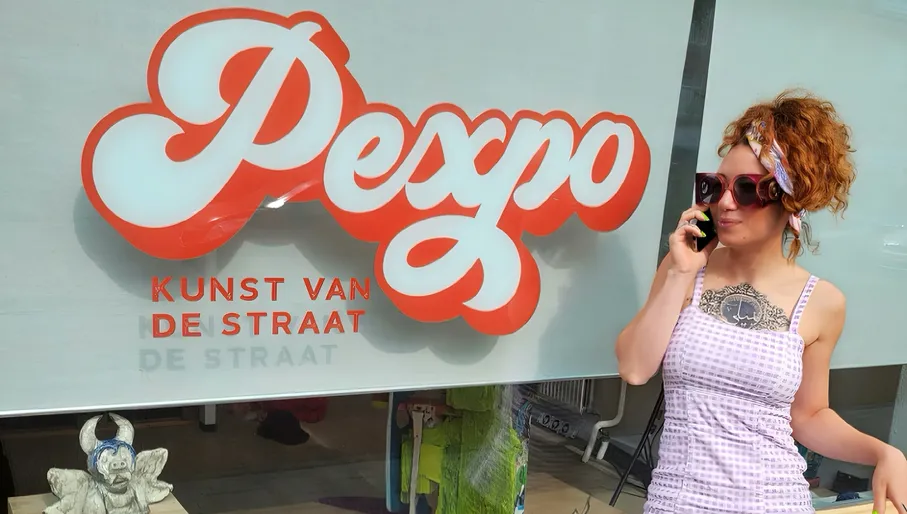 PEXPO lady posing in front of the window