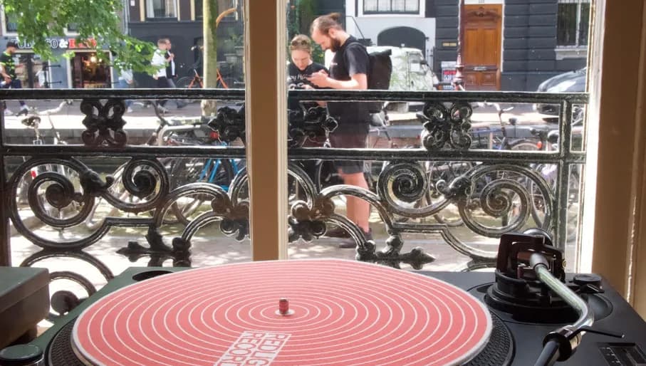 Vinyl player inside red light records shop