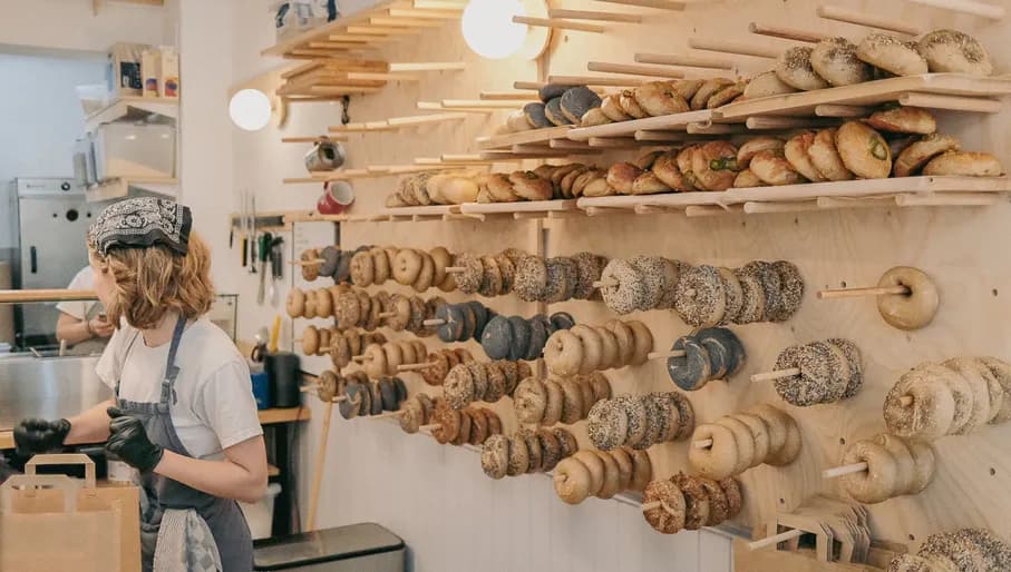 Breadwinner bagels stacked at the wall