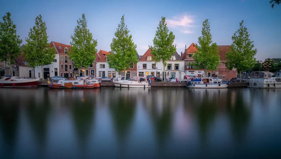 Treeline canal with docked boats - internal use royalty free, external use editorial only
